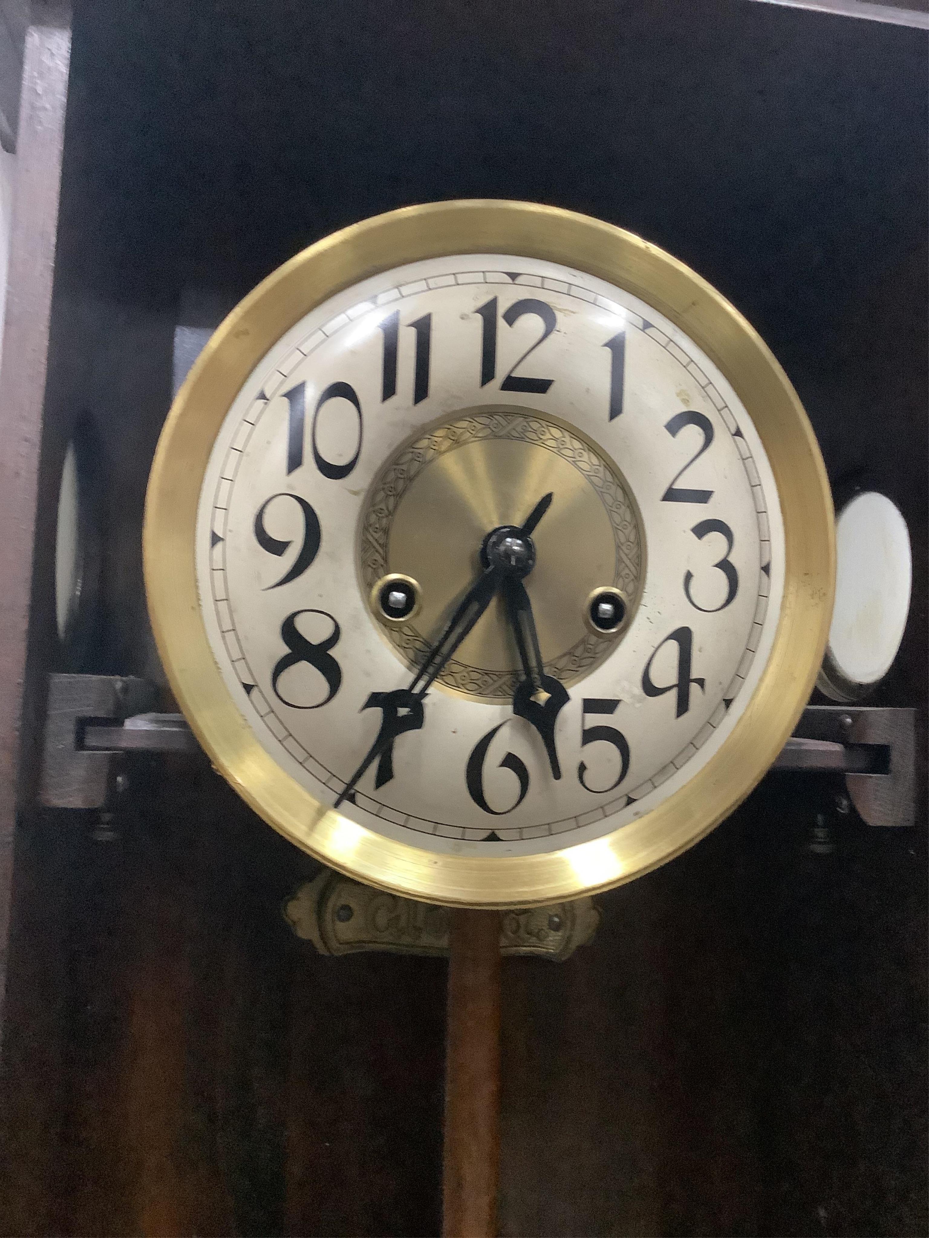 A 1930's stained beech eight day wall clock, height 77cm. Condition - good